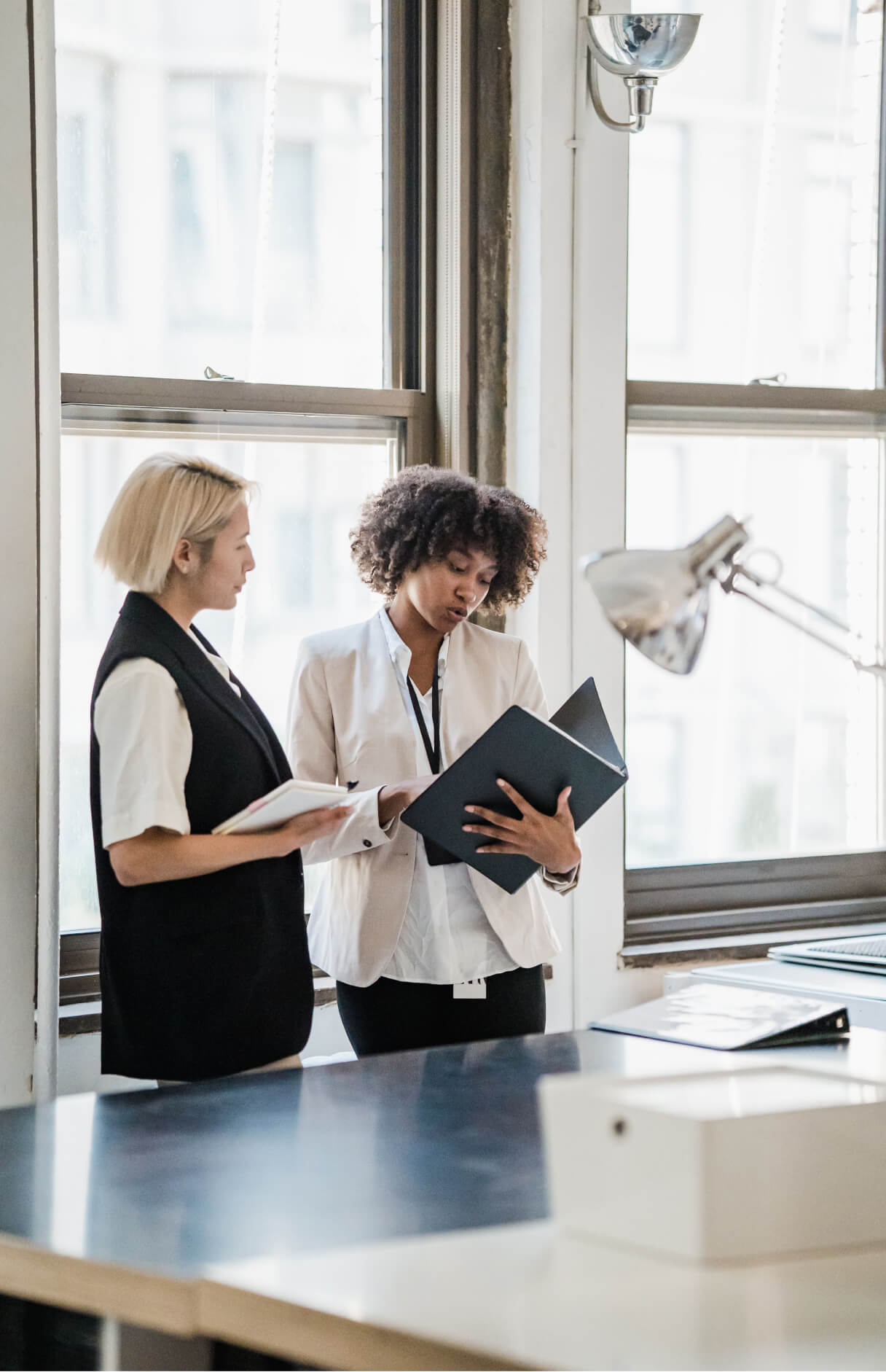 women looking at documents