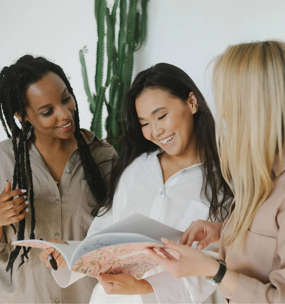 women looking at a brochure