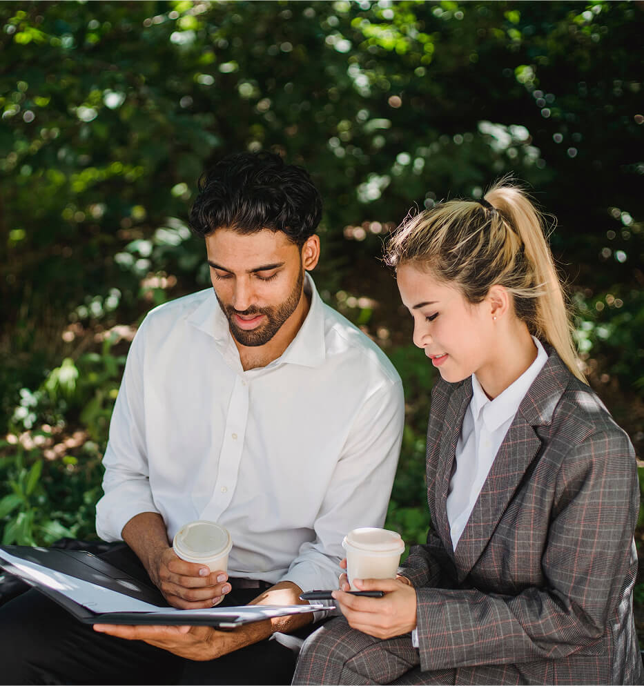man and woman looking at documents