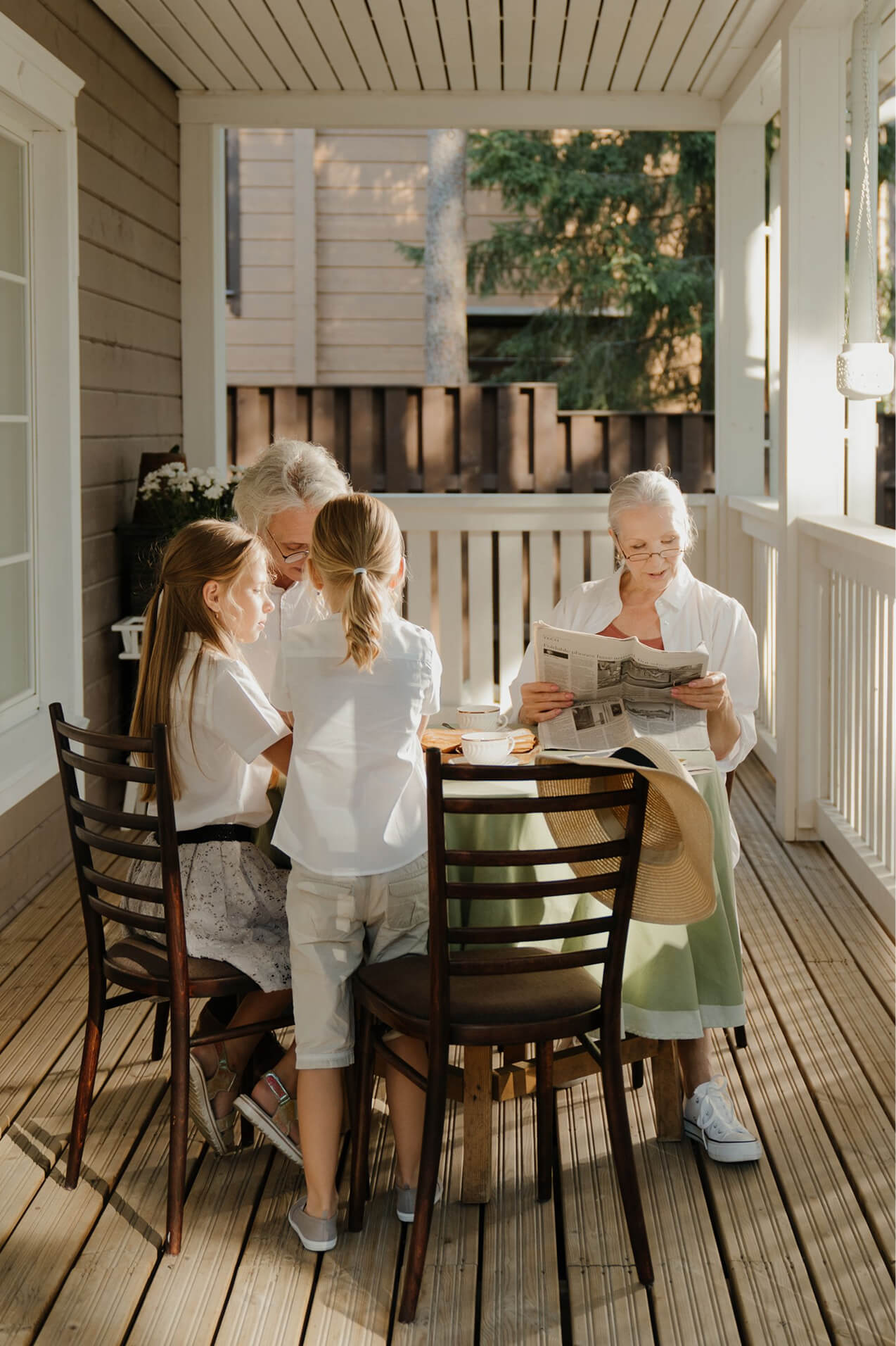 family sitting on porch